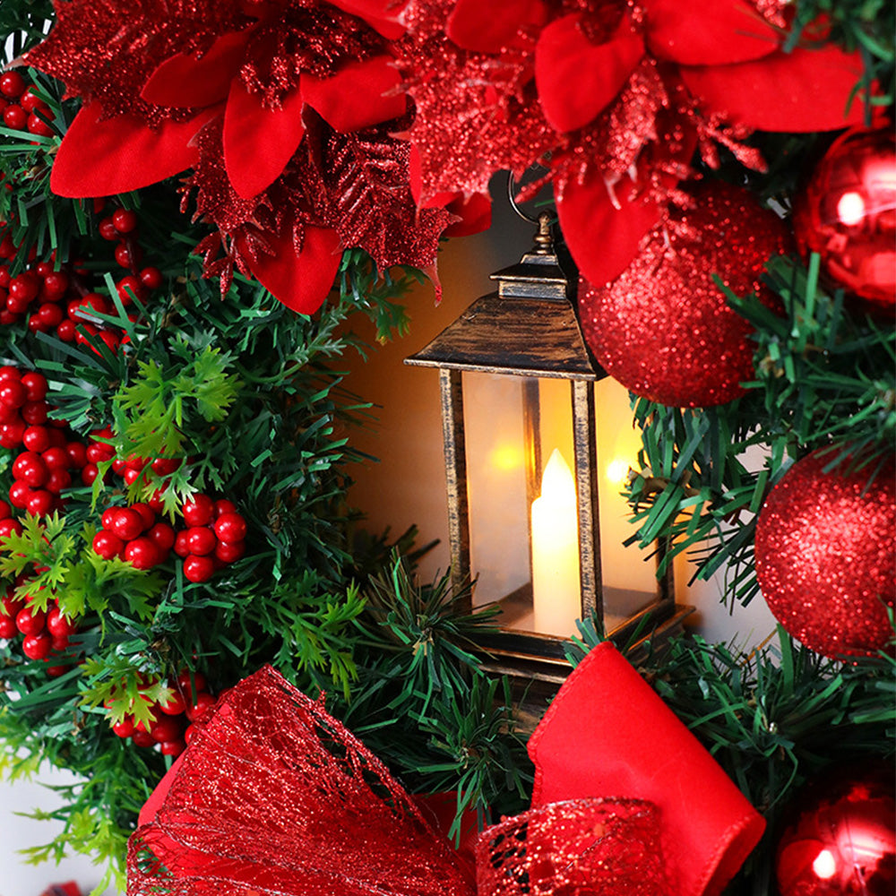 Weihnachtskranz mit LED-Lichtern und Schleife