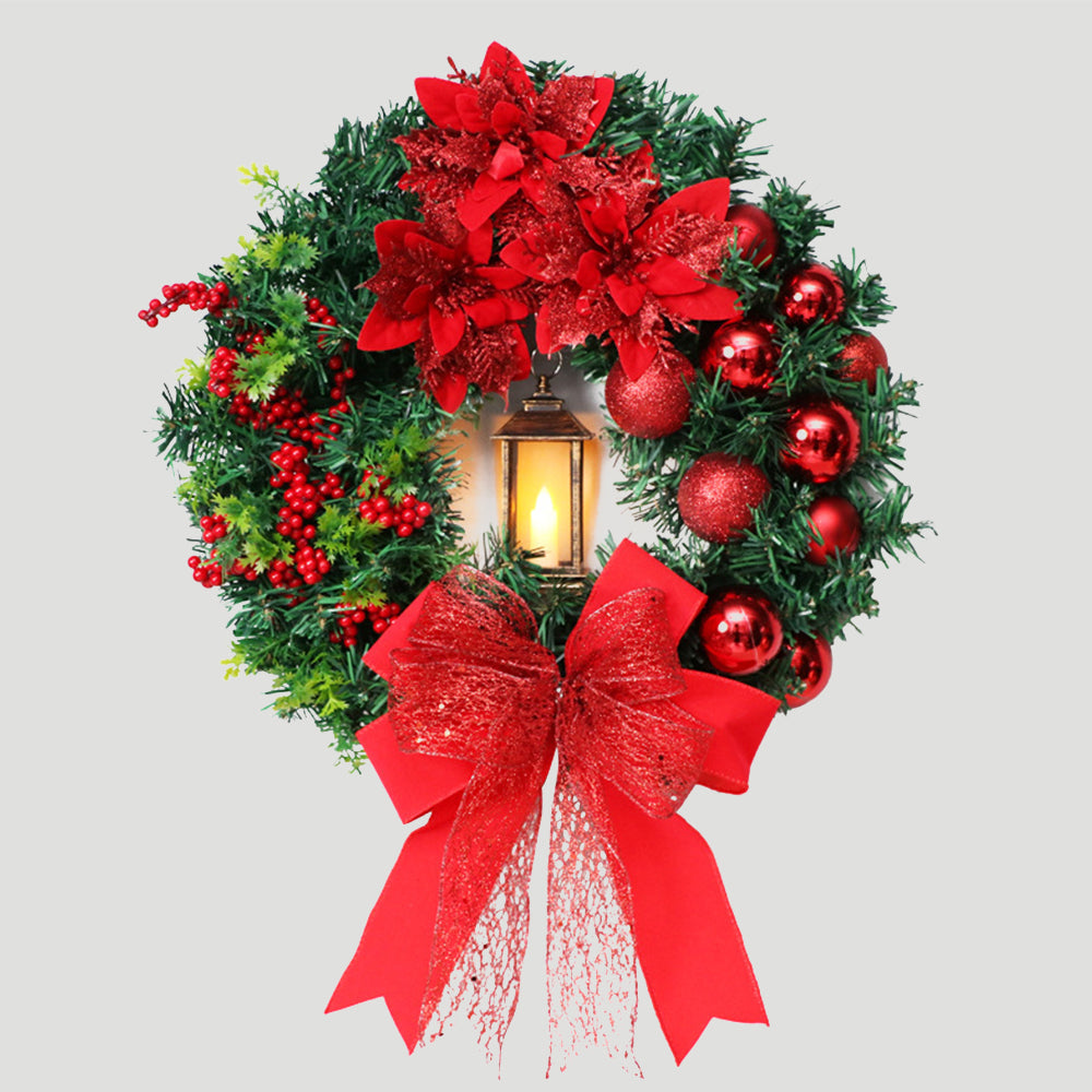 Weihnachtskranz mit LED-Lichtern und Schleife