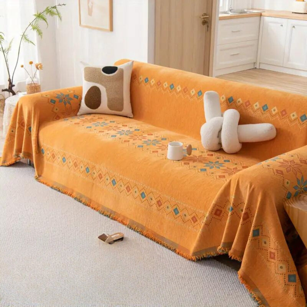 Copertura per divano con nappine bohemien in misto cotone