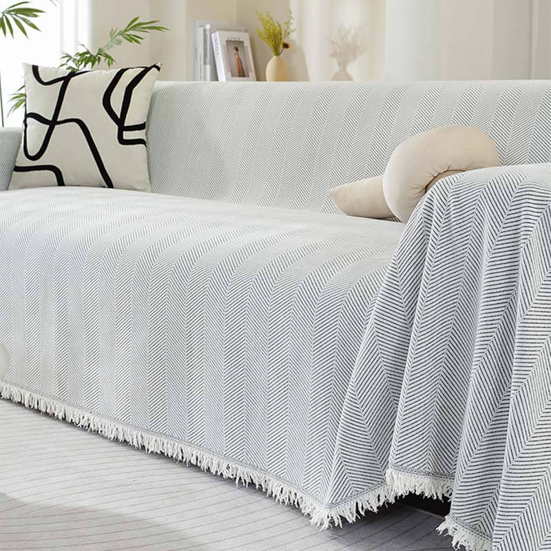 Housse de canapé en chenille motif chevrons avec franges