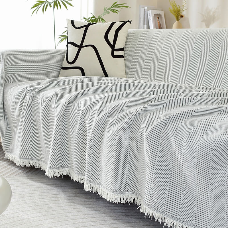 Housse de canapé en chenille motif chevrons avec franges