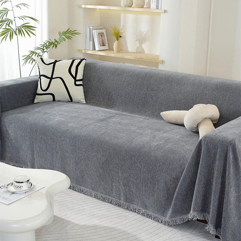 Housse de canapé en chenille motif chevrons avec franges
