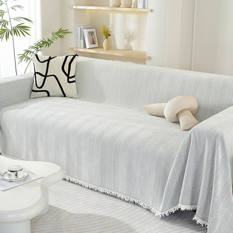 Housse de canapé en chenille motif chevrons avec franges