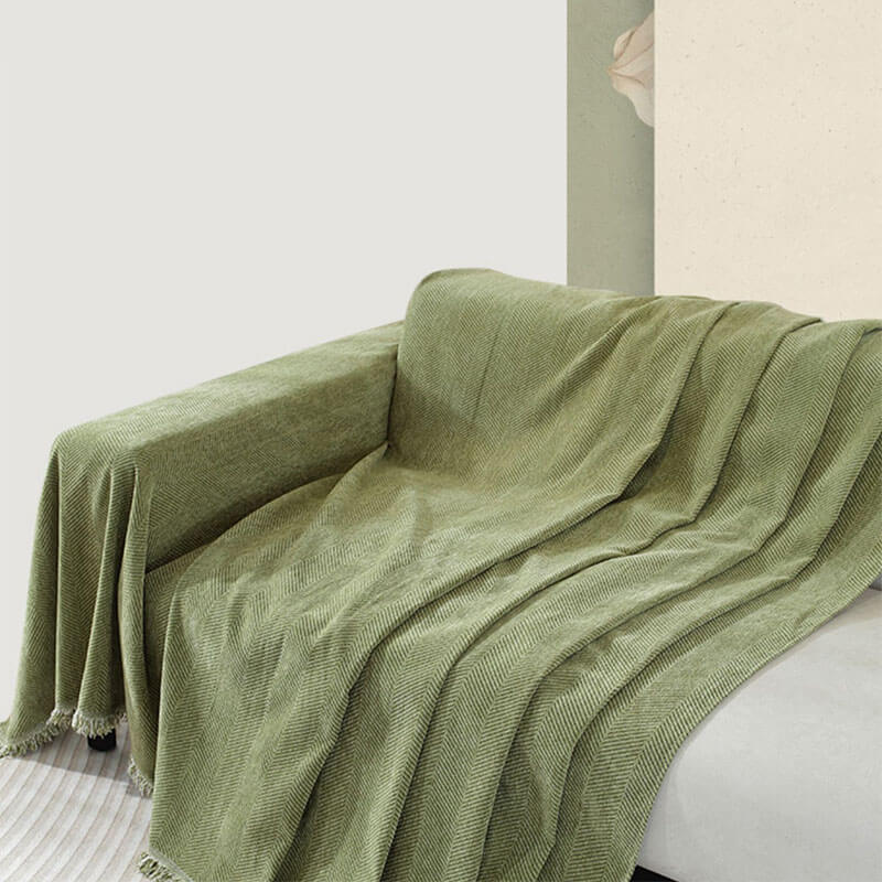 Housse de canapé en chenille motif chevrons avec franges