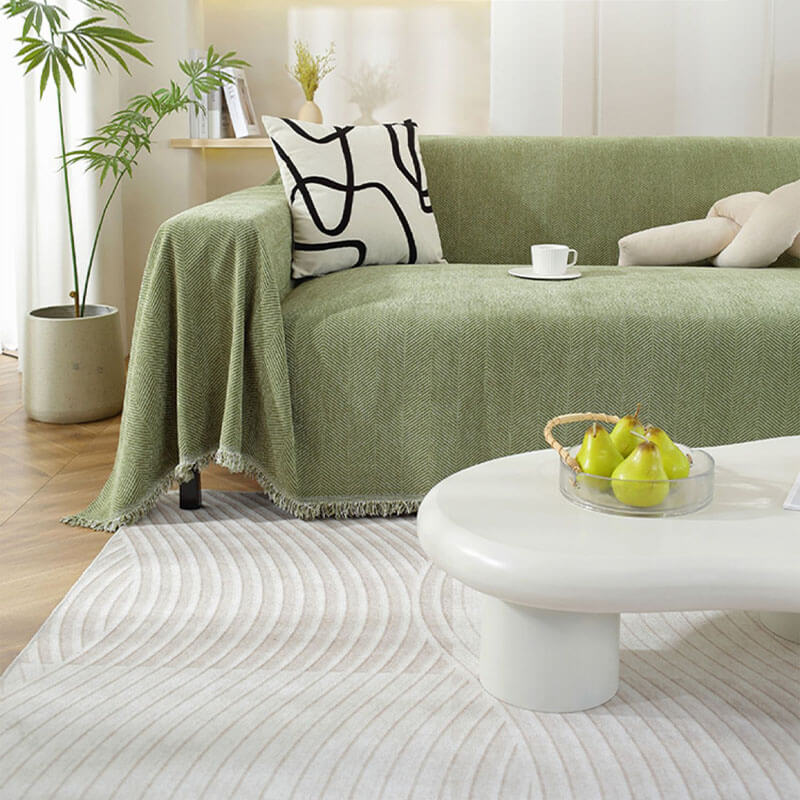Housse de canapé en chenille motif chevrons avec franges