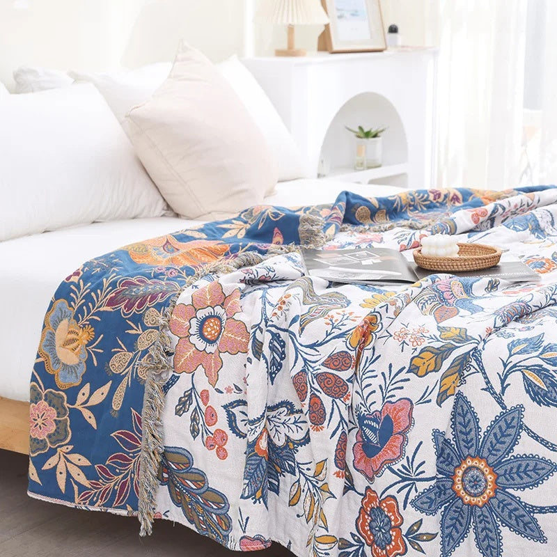 Coperta con nappine in cotone floreale