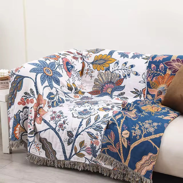 Coperta con nappine in cotone floreale