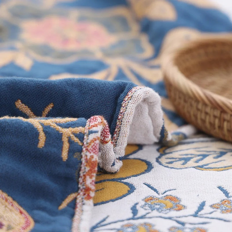 Coperta con nappine in cotone floreale