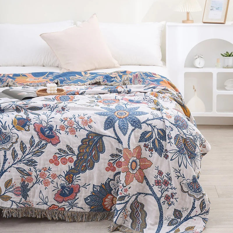 Coperta con nappine in cotone floreale
