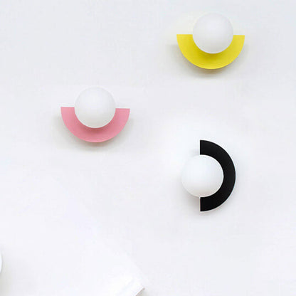 Applique murale à globe en verre avec base colorée