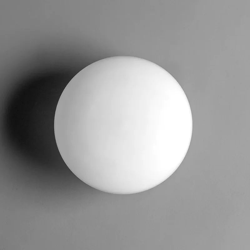 Lámpara de pared moderna con globo de cristal