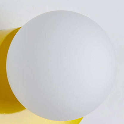 Applique murale à globe en verre avec base colorée