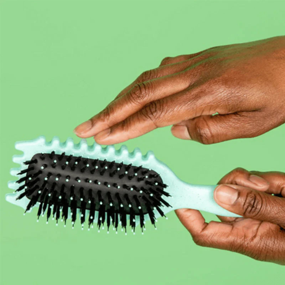 Brosse coiffante définissant les boucles et démêlante pour cheveux