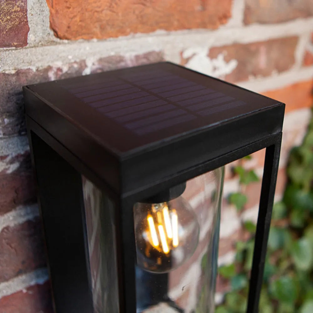 Aplique de pared para exterior con marco de metal negro