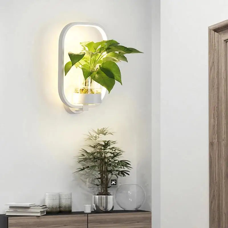 Lámpara de pared con macetero de cristal