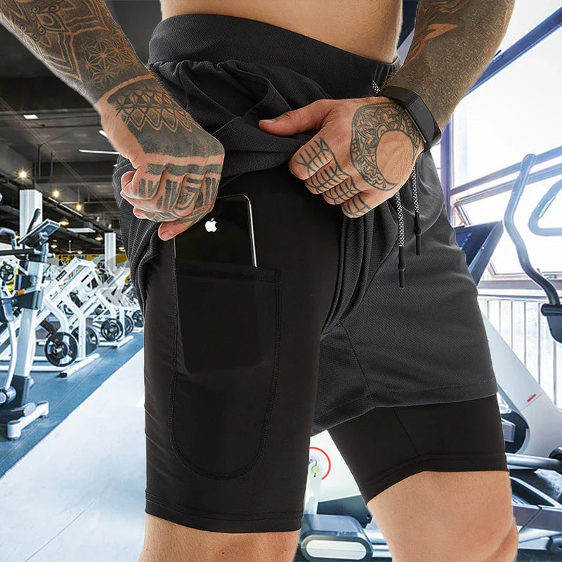 Pantalones cortos de gimnasio con bolsillo para teléfono y forro