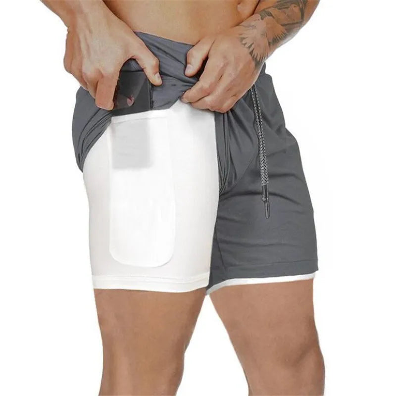 Pantalones cortos de gimnasio con bolsillo para teléfono y forro