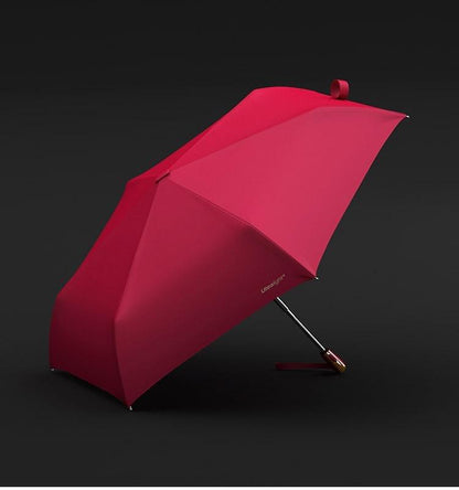 Paraguas de viaje plegable, resistente al viento y a los rayos UV, color rosa