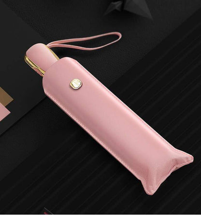 Paraguas de viaje plegable, resistente al viento y a los rayos UV, color rosa