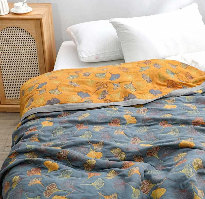 Manta reversible de algodón con estampado floral